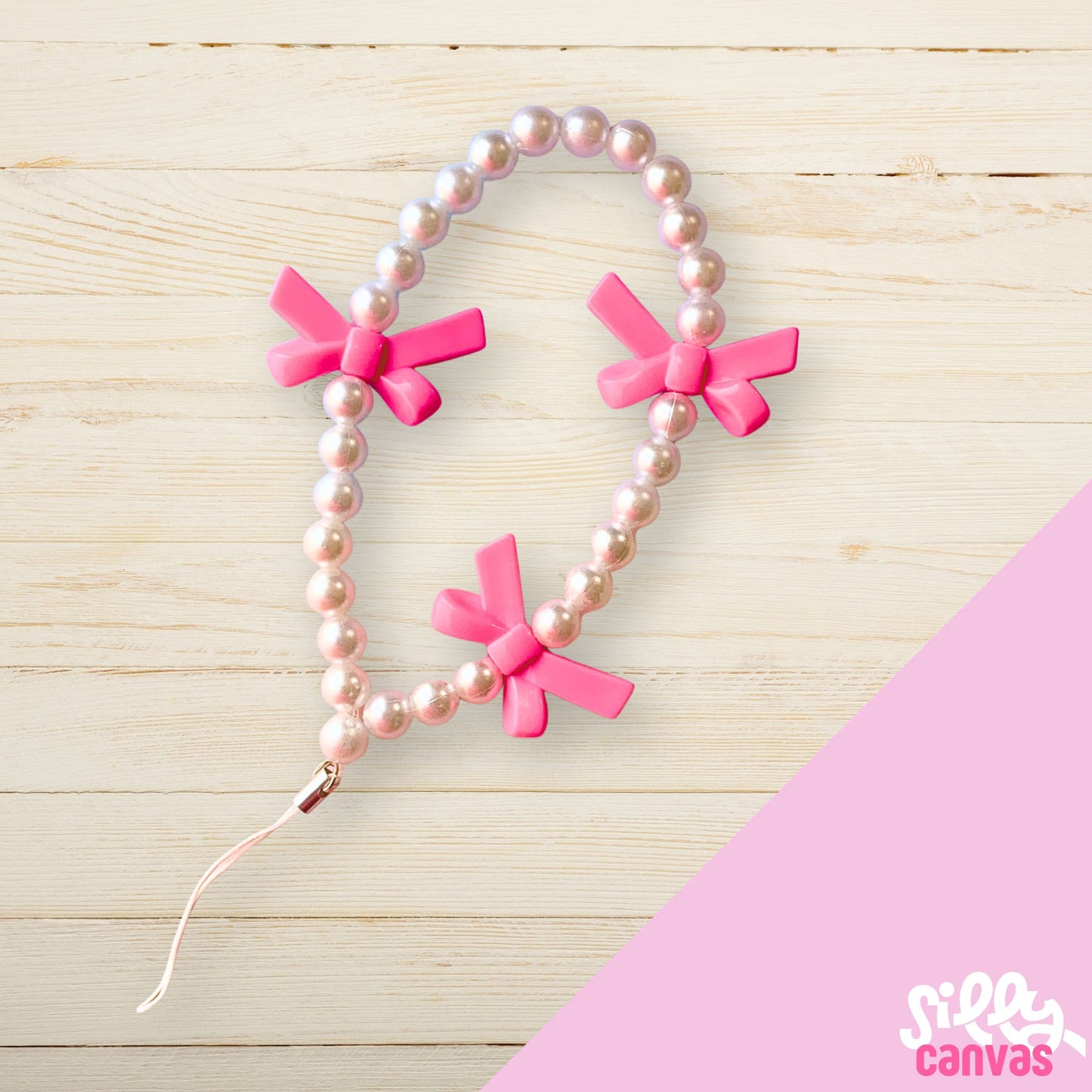 Pink bow phone charm with white beads