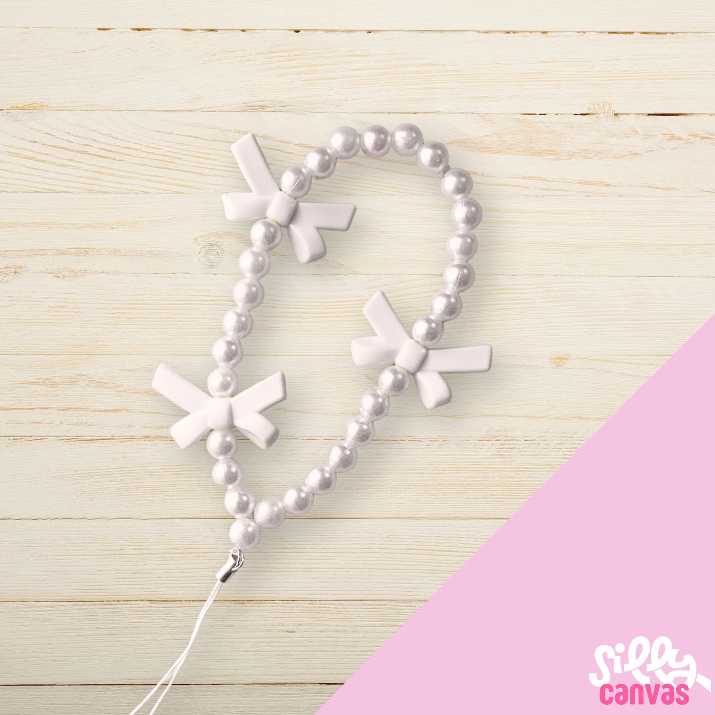 White bow phone charm with white beads